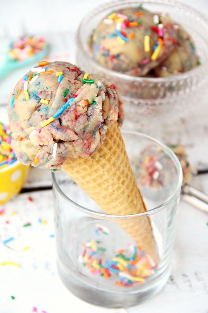 Edible Unicorn Cookie Dough - Looking for a fun, sweet treat that doesn't melt? This edible unicorn cookie dough is an eggless sugar cookie dough filled with colors and sprinkles!