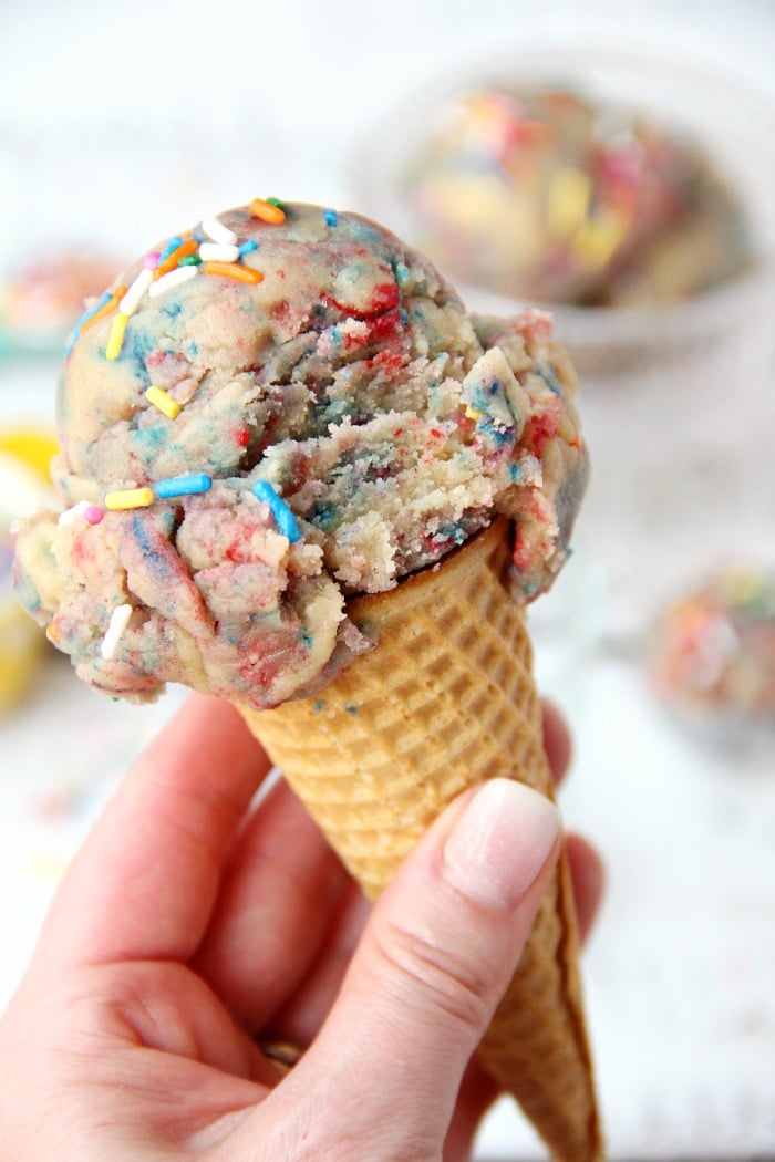 Edible Unicorn Cookie Dough - Looking for a fun, sweet treat that doesn't melt? This edible unicorn cookie dough is an eggless sugar cookie dough filled with colors and sprinkles!