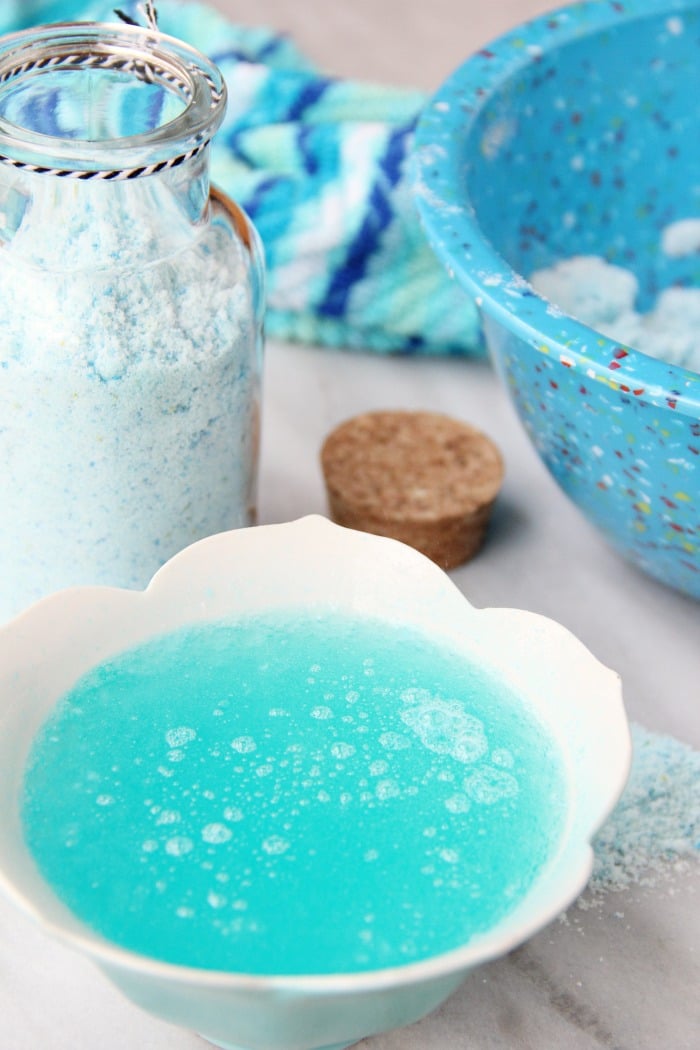 Fizzy Tropical Bath Powder - A light, airy, coconut scented powder that's calming, soothing and fizzes with pops of blue and green color when it hits the bath water, turning your water a beautiful turquoise blue.