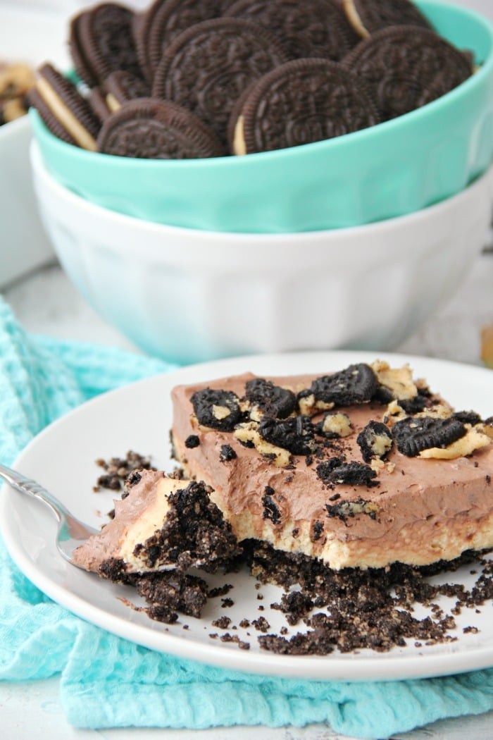 Peanut Butter Oreo Dessert - Fluffy layers of fudge and peanut butter on a Oreo peanut butter cookie crust!