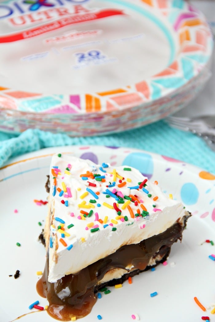 Ultimate Ice Cream Sundae Pie - Fudge and caramel topping filled ice cream pie with a fluffy whipped topping covered in sprinkles!