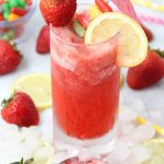 pink lemonade slush with strawberry and a lemon slice garnish