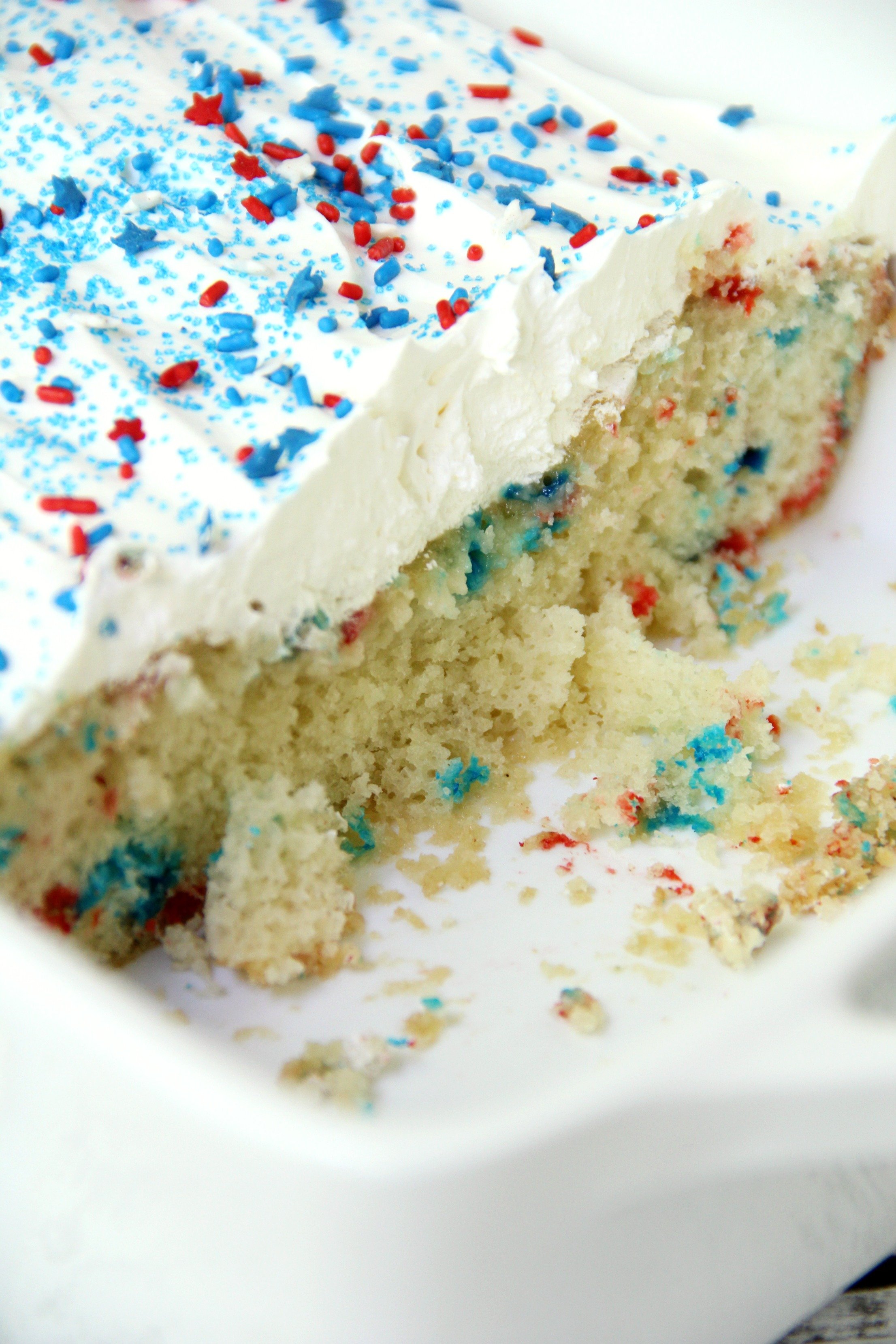 Red White & Blue Funfetti Cake - A simple DIY funfetti cake made with a box cake mix and sprinkles! So easy and perfect Memorial Day and 4th of July!