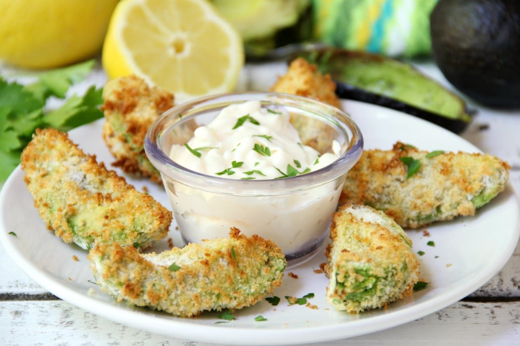 Air Fryer Avocado Wedges With Garlic Aioli Dipping Sauce - Perfectly golden and ready to eat in under 10 minutes, these crunchy avocado wedges are delicious when paired with this creamy garlic aioli dipping sauce! #airfryer #avocado #appetizer #aioli