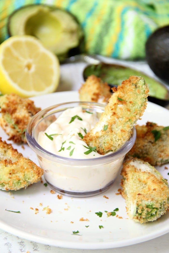 Air Fryer Avocado Wedges With Garlic Aioli Dipping Sauce - Perfectly golden and ready to eat in under 10 minutes, these crunchy avocado wedges are delicious when paired with this creamy garlic aioli dipping sauce! #airfryer #avocado #appetizer #aioli