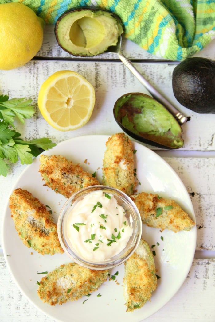 Air Fryer Avocado Wedges With Garlic Aioli Dipping Sauce - Perfectly golden and ready to eat in under 10 minutes, these crunchy avocado wedges are delicious when paired with this creamy garlic aioli dipping sauce! #airfryer #avocado #appetizer #aioli