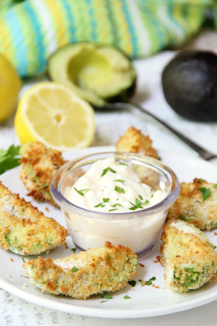 Air Fryer Avocado Wedges With Garlic Aioli Dipping Sauce - Perfectly golden and ready to eat in under 10 minutes, these crunchy avocado wedges are delicious when paired with this creamy garlic aioli dipping sauce! #airfryer #avocado #appetizer #aioli