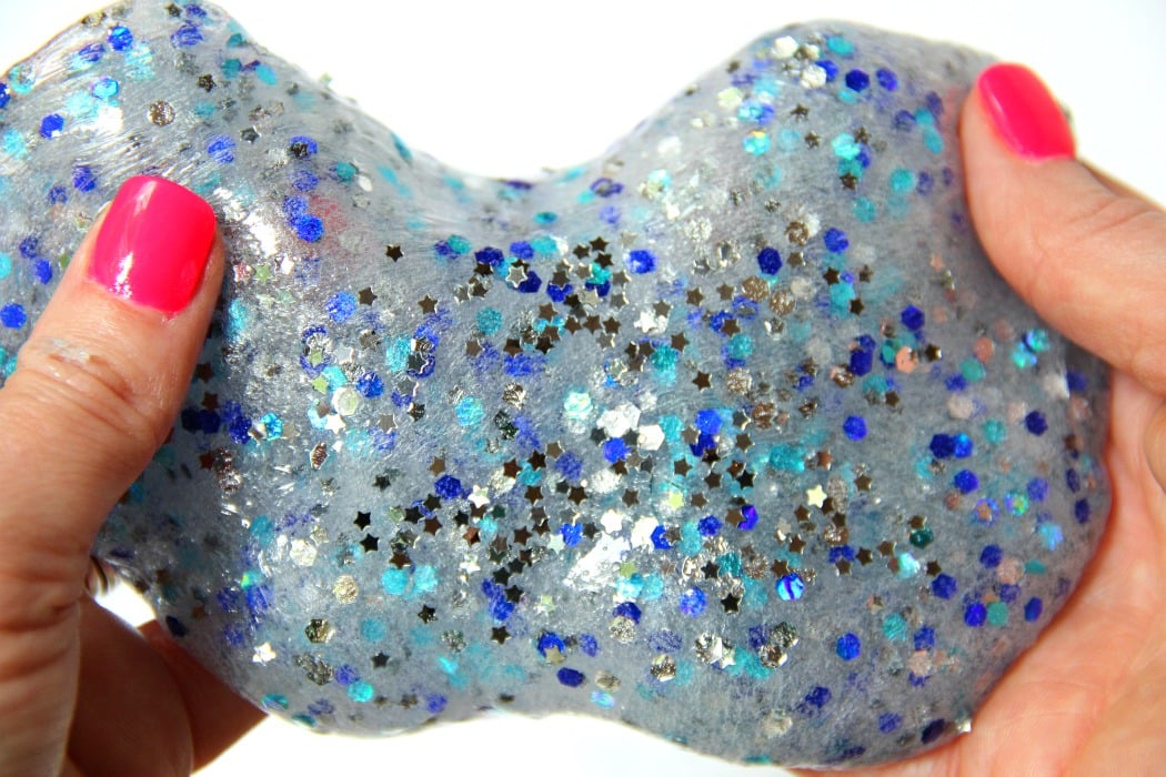 Clear Confetti Slime - Easy recipe for clear slime! Add confetti and foil stars to give it color and make it sparkle. So pretty!