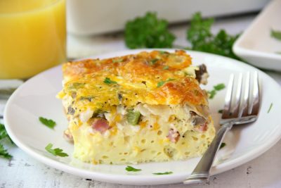 Ultimate Oven Omelette - This omelette is filled with veggies, ham and cheese and baked in the oven. Perfect for a party crowd!