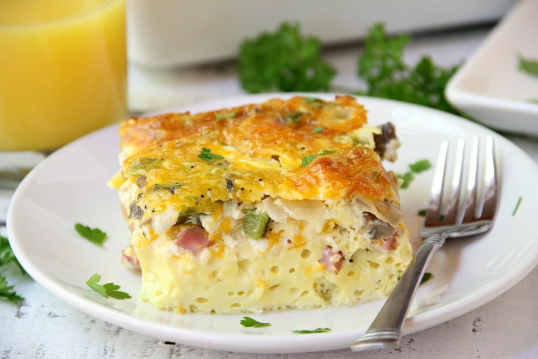 Ultimate Oven Omelette - This omelette is filled with veggies, ham and cheese and baked in the oven. Perfect for a party crowd!