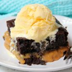 Easy Caramel Fudge Cake - An easy chocolate fudge cake filled with gooey melted caramel. No frosting required! Serve warm with a scoop of vanilla ice cream! Sooo good!