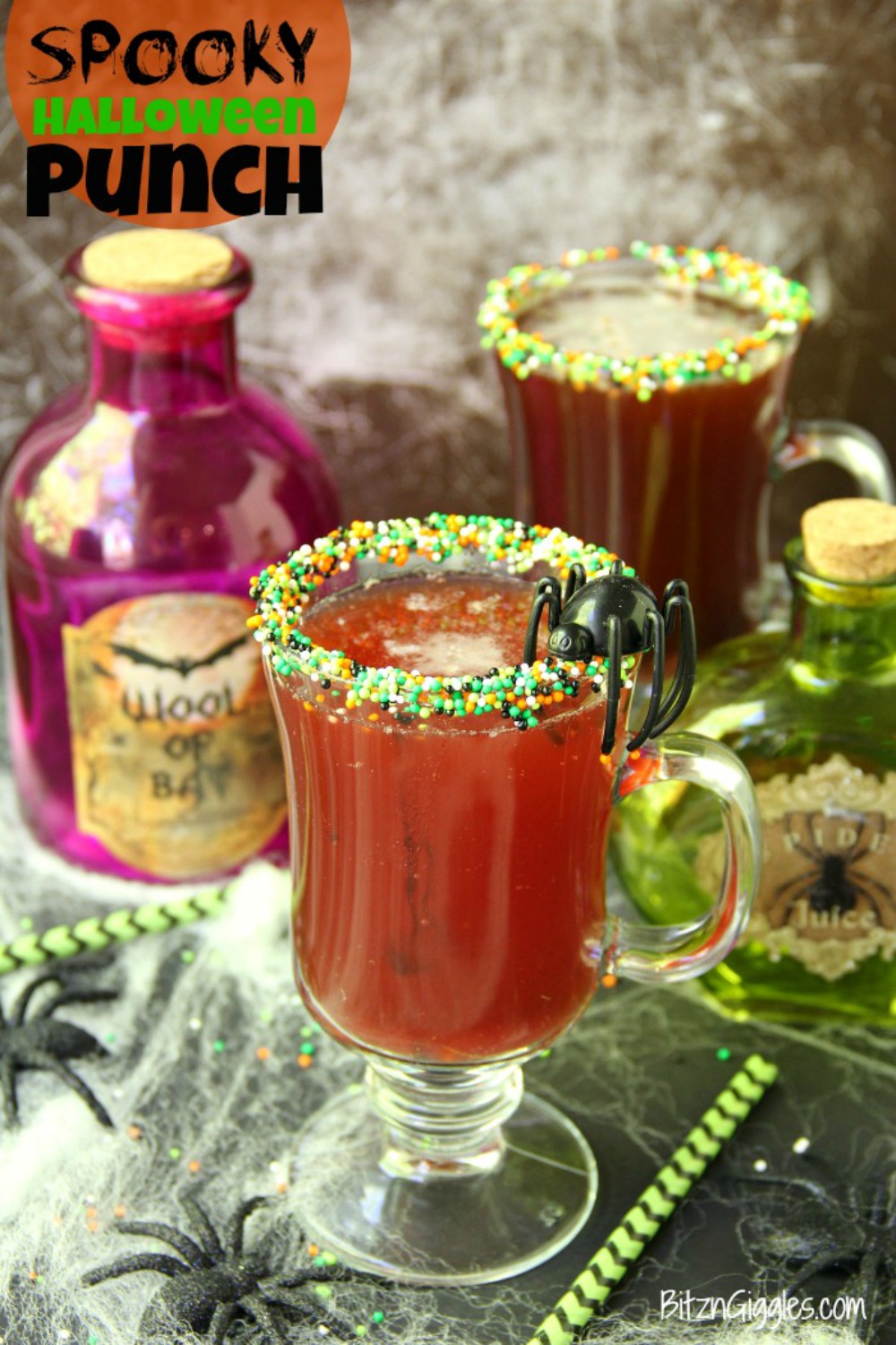 Spooky Halloween Punch - This Halloween punch is only three ingredients! When served in a nonpareil-rimmed glass, the color of the candy starts dripping eerily into the punch, creating fun black streaks and darkening the color of the drink!