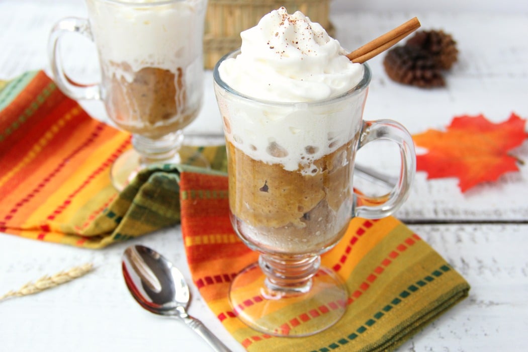 Pumpkin Mug Cake - A quick and easy microwave pumpkin mug cake. Topped with whipped cream and a cinnamon stick, this is the ultimate simple fall dessert!