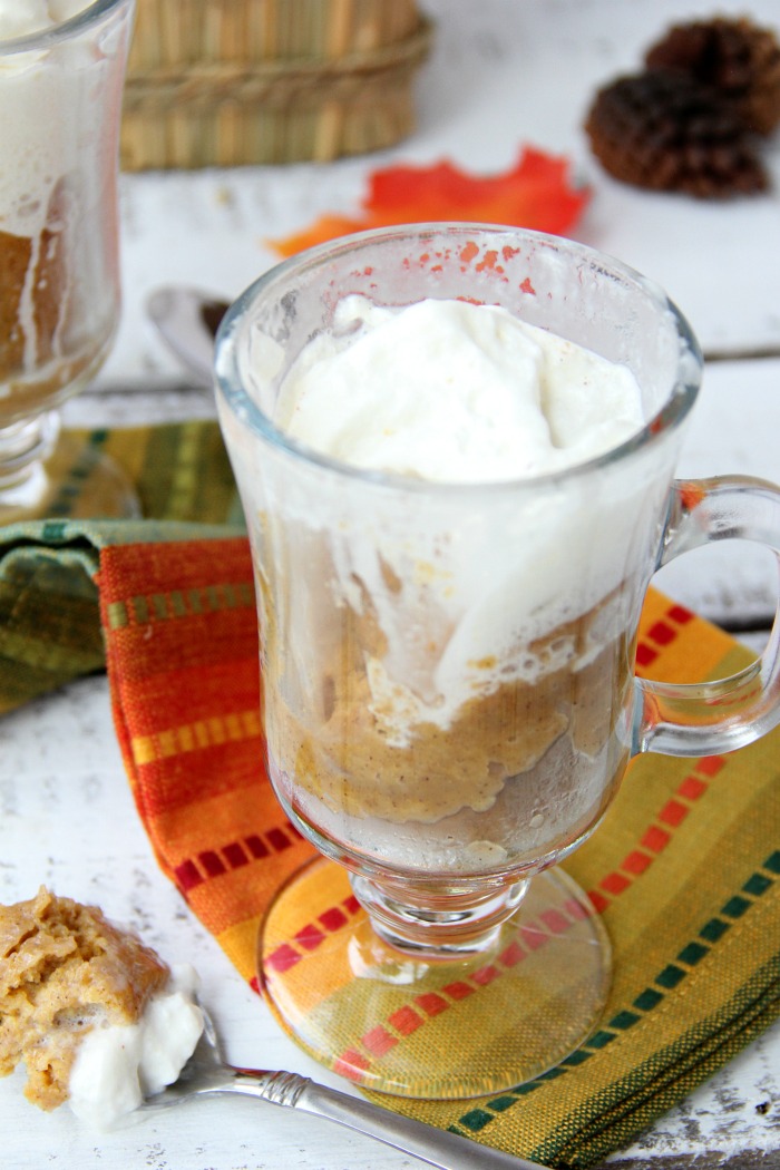 Pumpkin Mug Cake - A quick and easy microwave pumpkin mug cake. Topped with whipped cream and a cinnamon stick, this is the ultimate simple fall dessert!