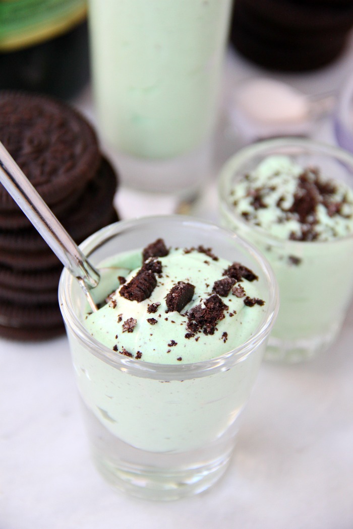 Mint Oreo Pudding Shots - Perfect for the holidays, St. Patrick's Day or just whenever you're in the mood for a little taste of mint and chocolate. These taste just like an adult version of a Thin Mint Girl Scout Cookie!