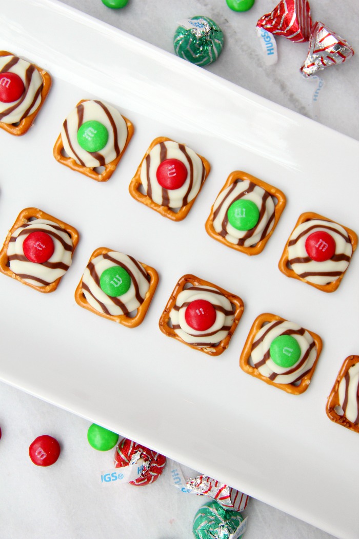 Pretzel M&M Hugs- Sweet and salty three-ingredient bite-sized treats perfect for Christmas and the holidays!