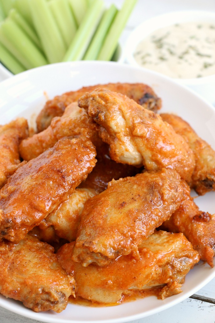 Air Fryer Chicken Wings - Delicious hot wings made in the air fryer in under 20 minutes. Use the sauce recipe provided or choose your favorite sauce!