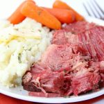 Instant Pot Corned Beef - Deliciously tender, juicy and flavorful corned beef and baby carrots made in your Instant Pot or Ninja Foodi in under two hours!