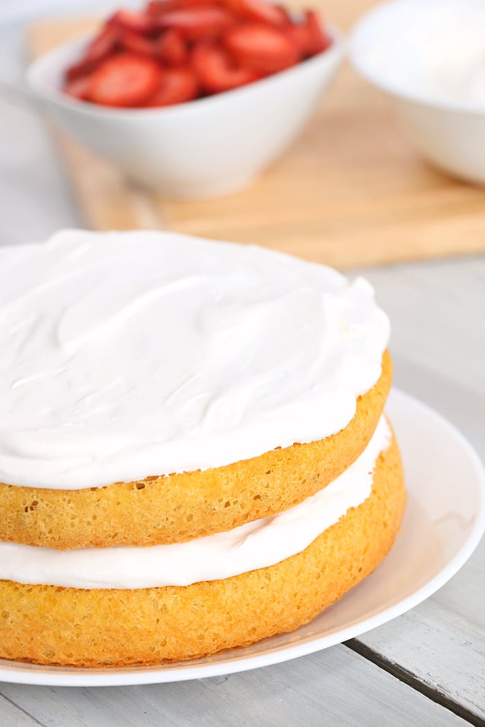 Air Fryer Angel Food Cake - A simple and beautiful layered cake topped with strawberries and cream, made right in the air fryer!