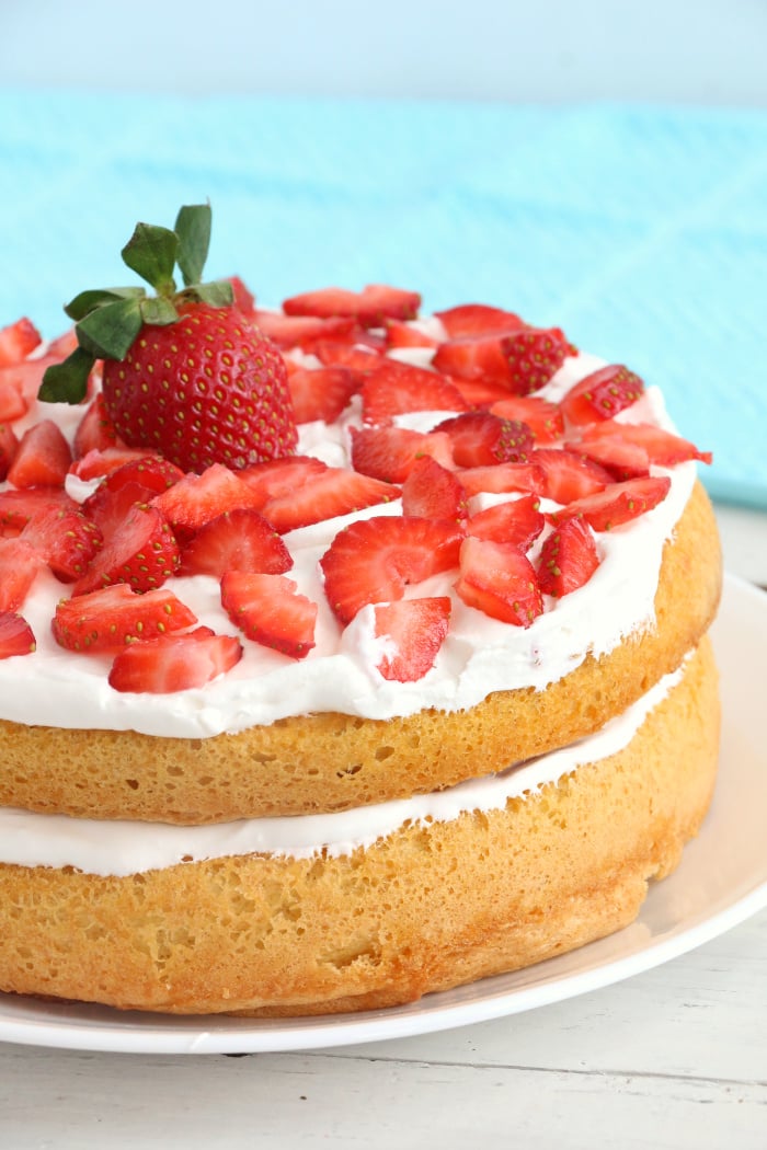 Air Fryer Angel Food Cake - A simple and beautiful layered cake topped with strawberries and cream, made right in the air fryer!