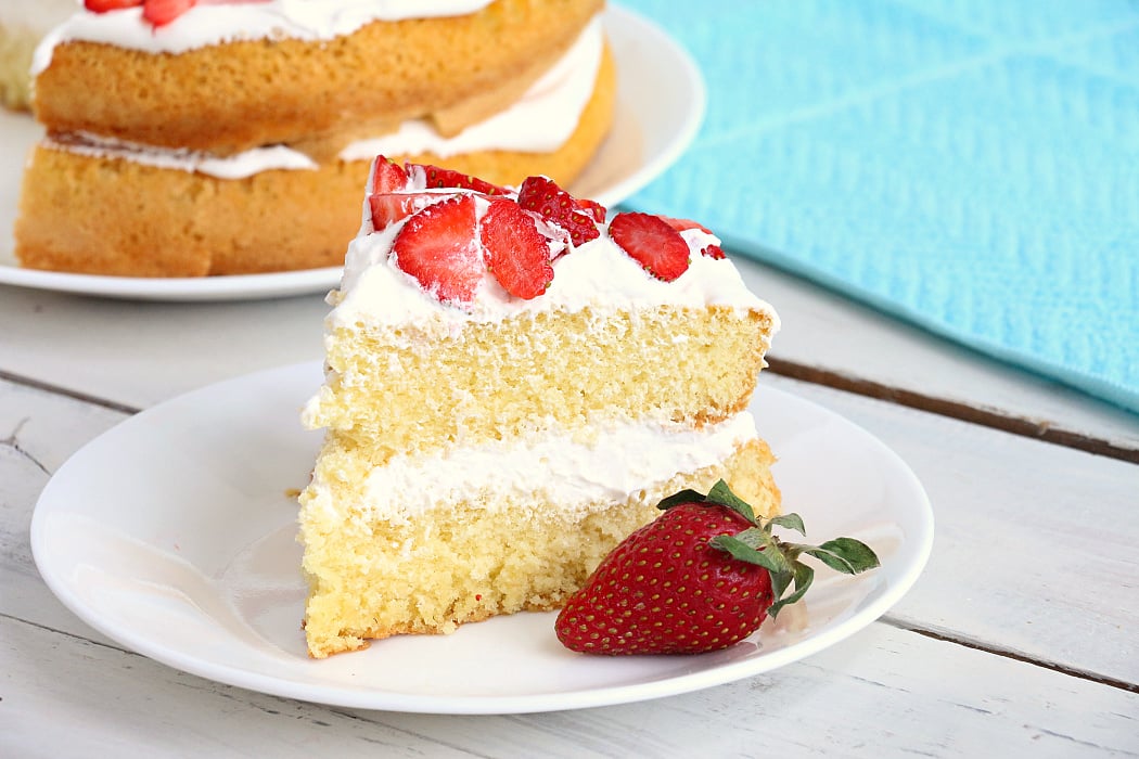 Air Fryer Angel Food Cake - A simple and beautiful layered cake topped with strawberries and cream, made right in the air fryer!