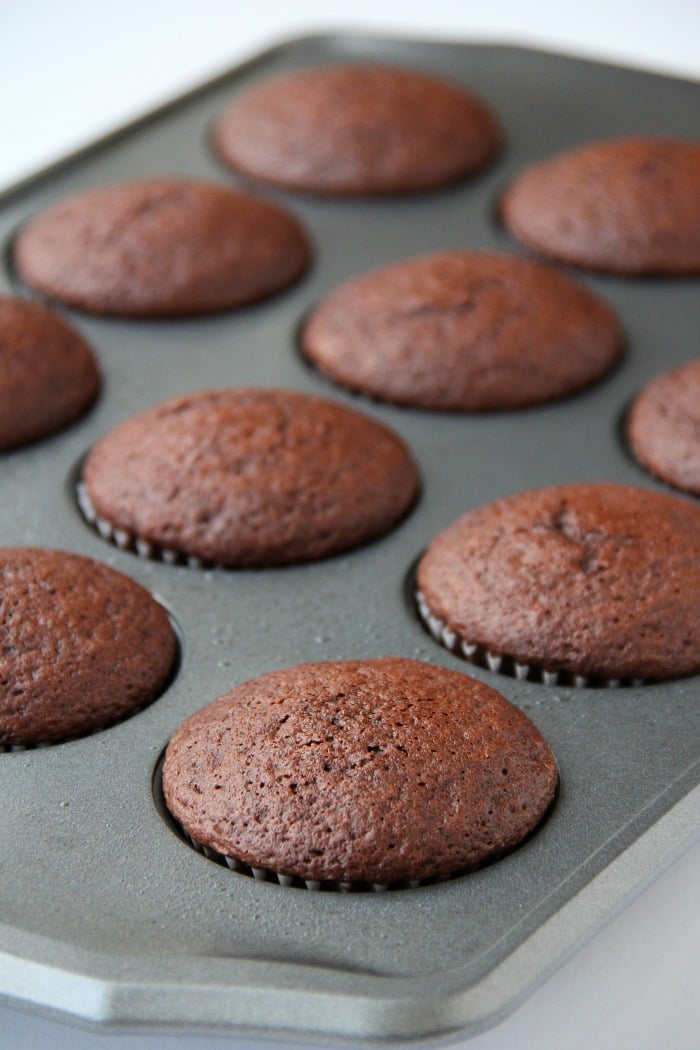 Guinness Cupcakes With Bailey's Frosting - Easy & delicious rich chocolate cupcakes spiked with Guinness and topped with creamy Bailey's Irish Cream frosting!