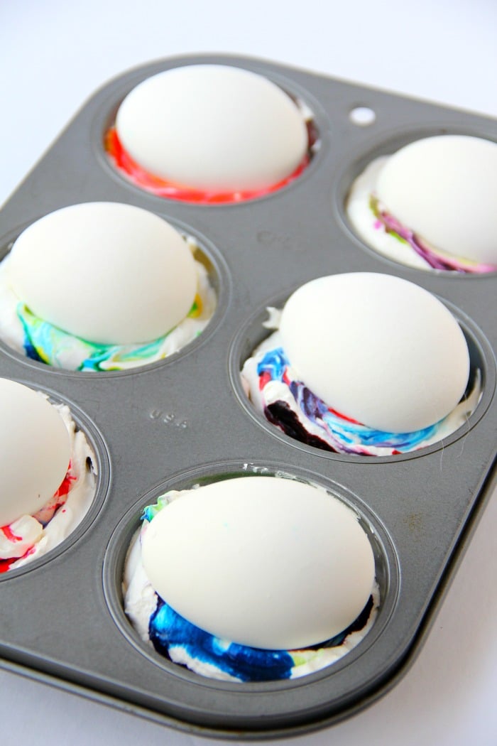 Cool Whip Easter Eggs - Cool Whip helps produce swirls of gorgeous color in this family-friendly DIY easter egg dyeing method!