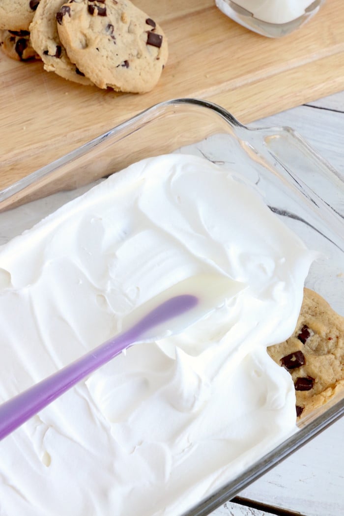 Chocolate Chip Cookie Lasagna - A delicious 4-ingredient, no bake layer dessert made with soft chocolate chip cookies and creamy whipped topping.