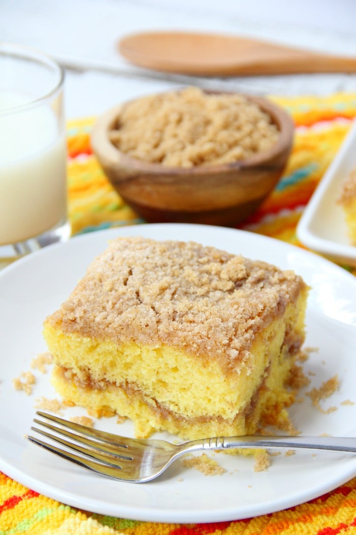 Easy Coffee Cake - A delicious and easy coffee cake made with a doctored-up yellow cake mix and filled and topped with crumbly, buttery cinnamon streusel!