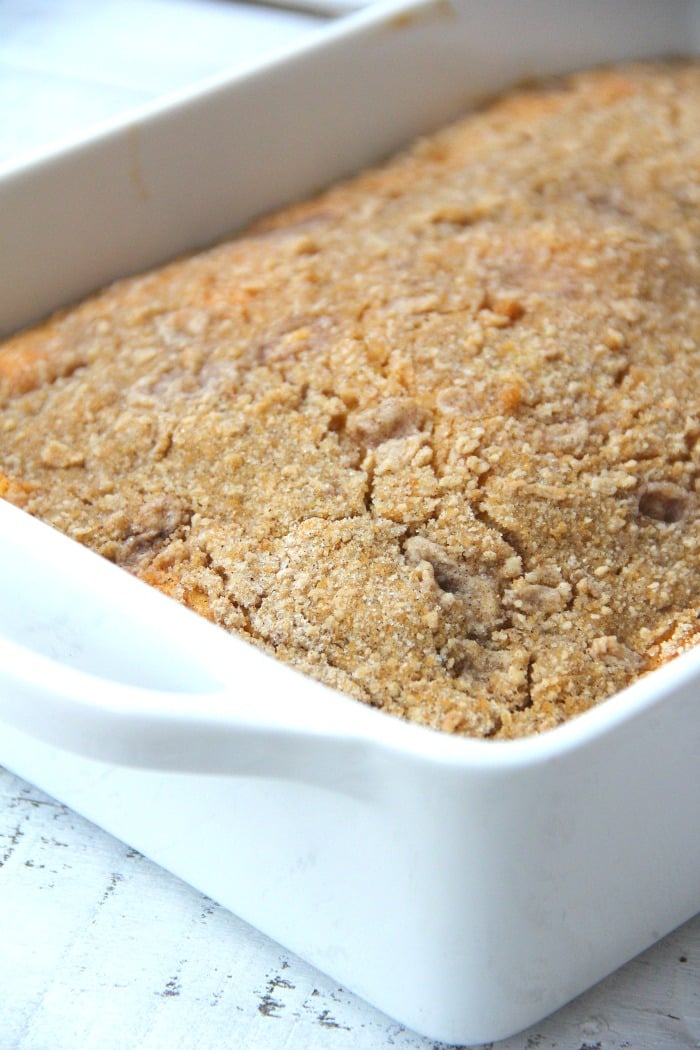 Easy Coffee Cake - A delicious and easy coffee cake made with a doctored-up yellow cake mix and filled and topped with crumbly, buttery cinnamon streusel!