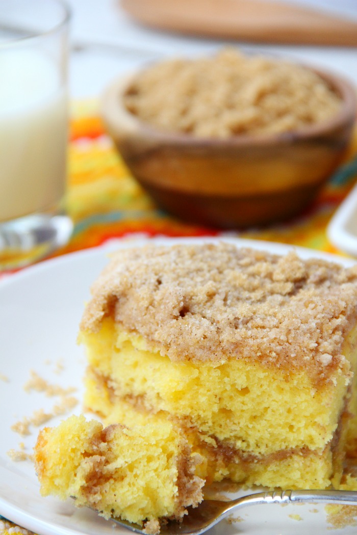 Easy Coffee Cake - A delicious and easy coffee cake made with a doctored-up yellow cake mix and filled and topped with crumbly, buttery cinnamon streusel!