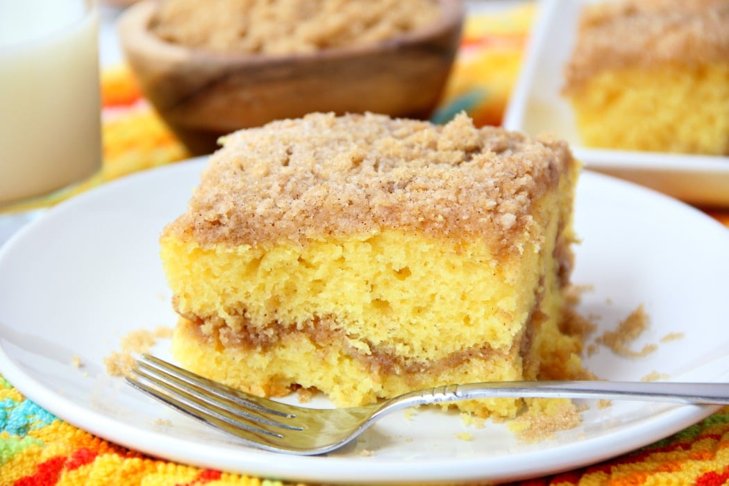 Easy Coffee Cake - A delicious and easy coffee cake made with a doctored-up yellow cake mix and filled and topped with crumbly, buttery cinnamon streusel!