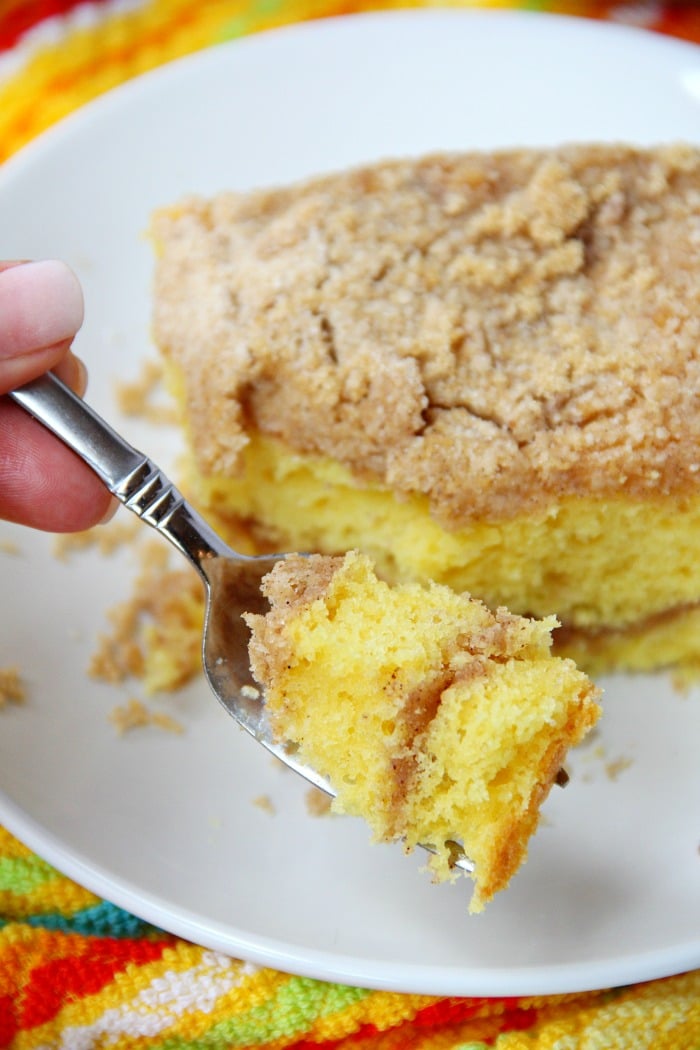 Easy Coffee Cake - A delicious and easy coffee cake made with a doctored-up yellow cake mix and filled and topped with crumbly, buttery cinnamon streusel!