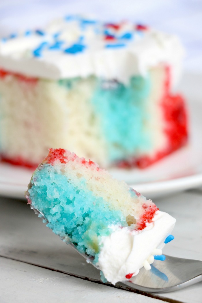 Red White and Blue Jello Poke Cake - A colorful and delicious cake, perfect for Memorial Day, the 4th of July or any patriotic celebration! The Jello is what makes it super moist!