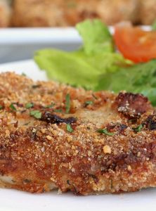 Air Fryer Pork Chops - Pork chops dredged in ranch dressing, coated in a parmesan cheese breadcrumb mixture and air fried to perfection. Tender on the inside and crispy on the outside!