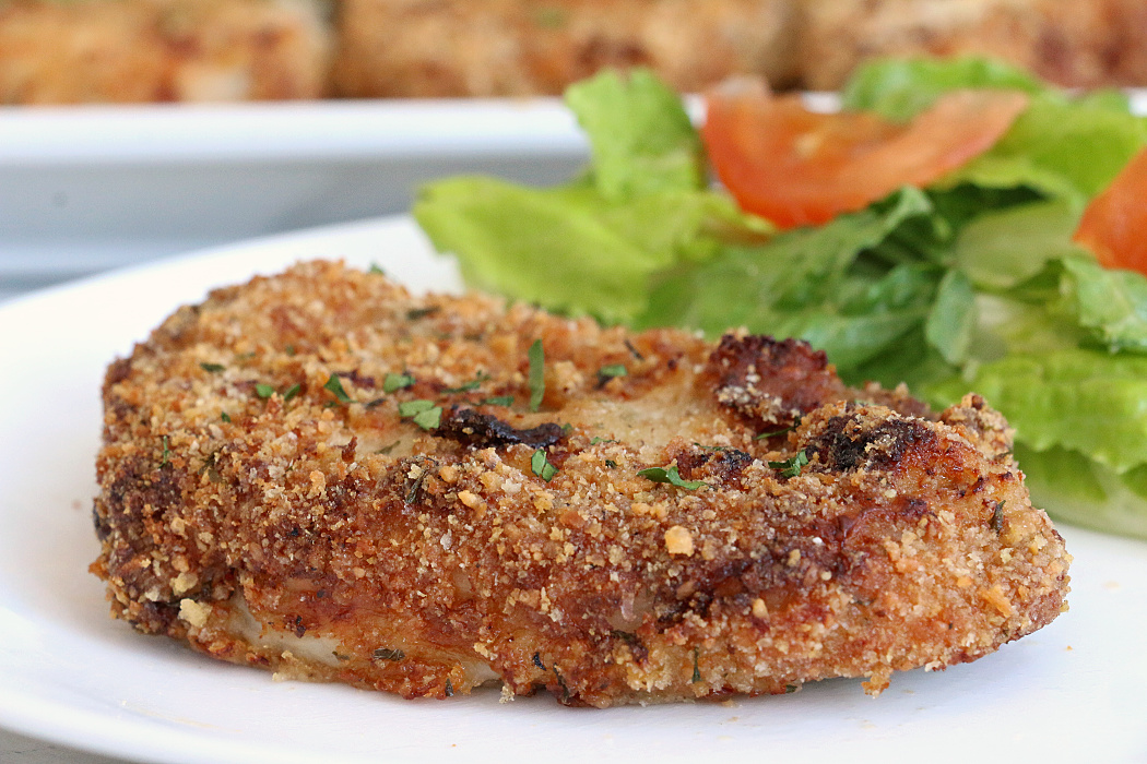 Air Fryer Pork Chops - Pork chops dredged in ranch dressing, coated in a parmesan cheese breadcrumb mixture and air fried to perfection. Tender on the inside and crispy on the outside!