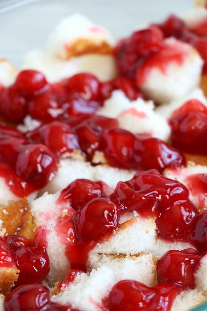 No Bake Cherry Dump Cake - An easy, no-bake cherry trifle dessert withÂ layers of angel food cake, sour cream, pudding, cherry pie filling and whipped topping.