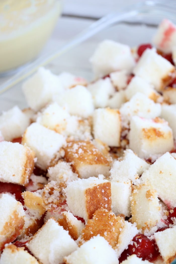 No Bake Cherry Dump Cake - An easy, no-bake cherry trifle dessert withÂ layers of angel food cake, sour cream, pudding, cherry pie filling and whipped topping.