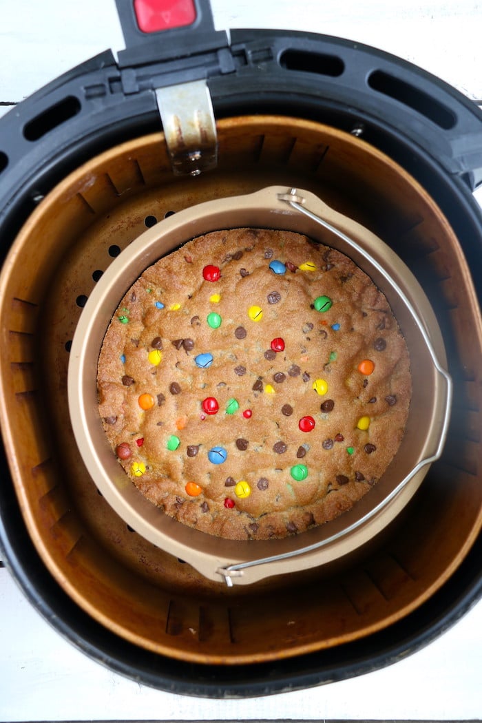 Air Fryer Pizookie - A soft and chewy cookie filled with mini chocolate chips and M&Ms made right in the air fryer in under 10 minutes! Large enough to serve a crowd!