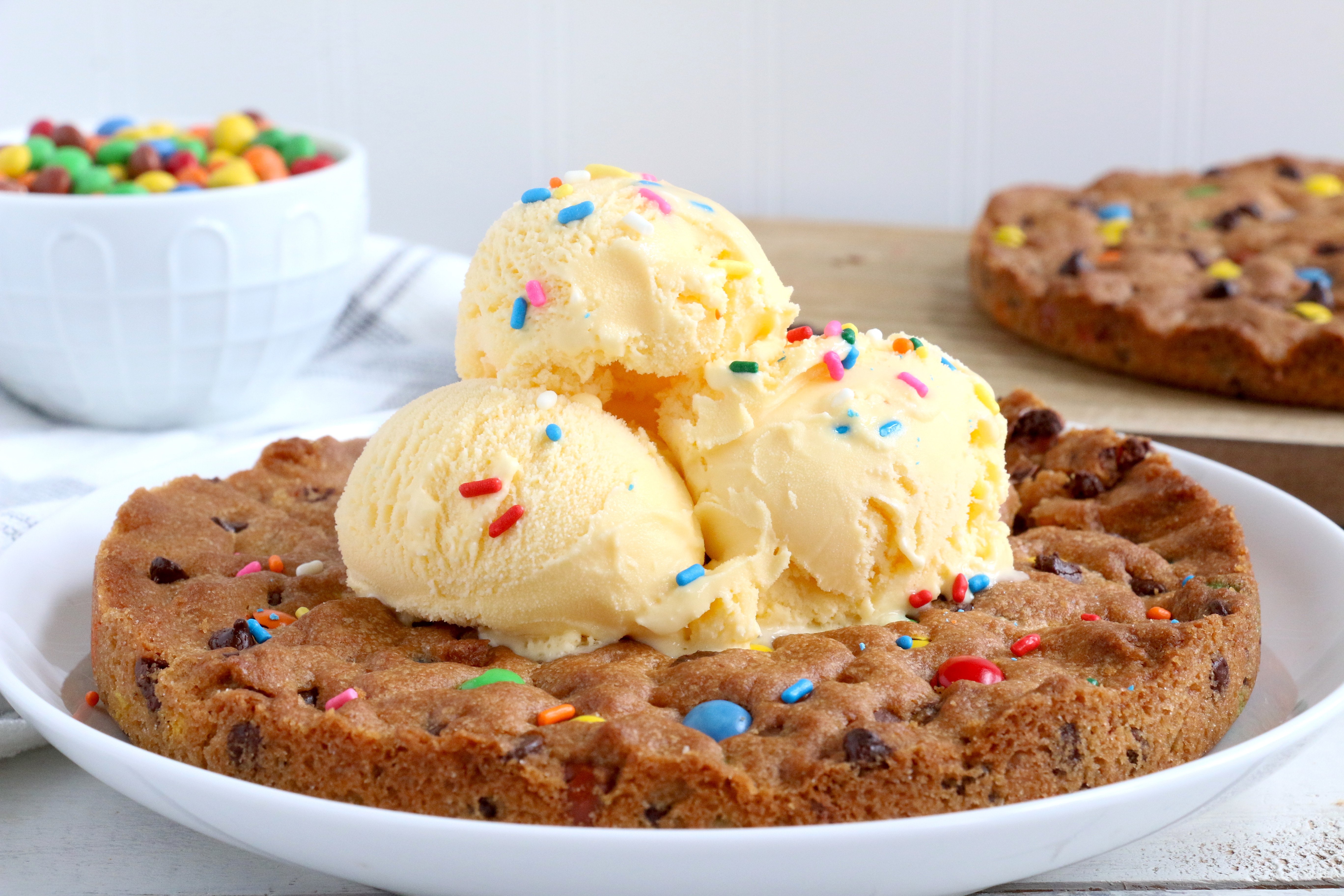 Air Fryer Pizookie - A soft and chewy cookie filled with mini chocolate chips and M&Ms made right in the air fryer in under 10 minutes! Large enough to serve a crowd!