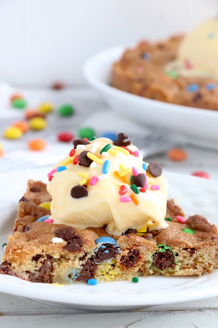 Air Fryer Pizookie - A soft and chewy cookie filled with mini chocolate chips and M&Ms made right in the air fryer in under 10 minutes! Large enough to serve a crowd!