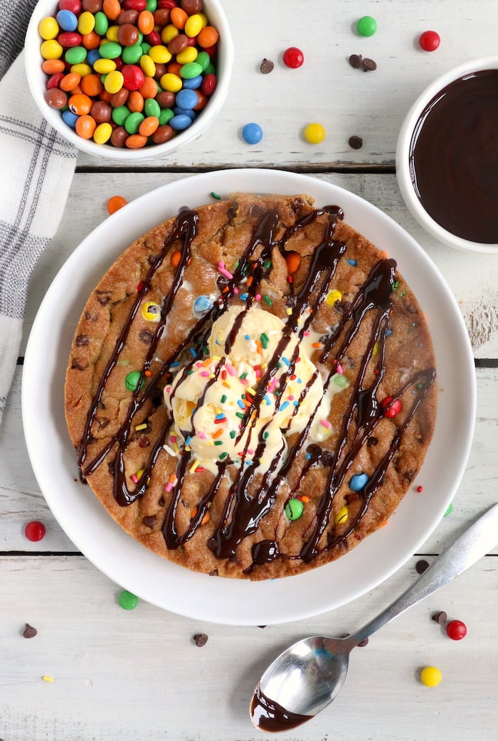 Air Fryer Pizookie - A soft and chewy cookie filled with mini chocolate chips and M&Ms made right in the air fryer in under 10 minutes! Large enough to serve a crowd! 