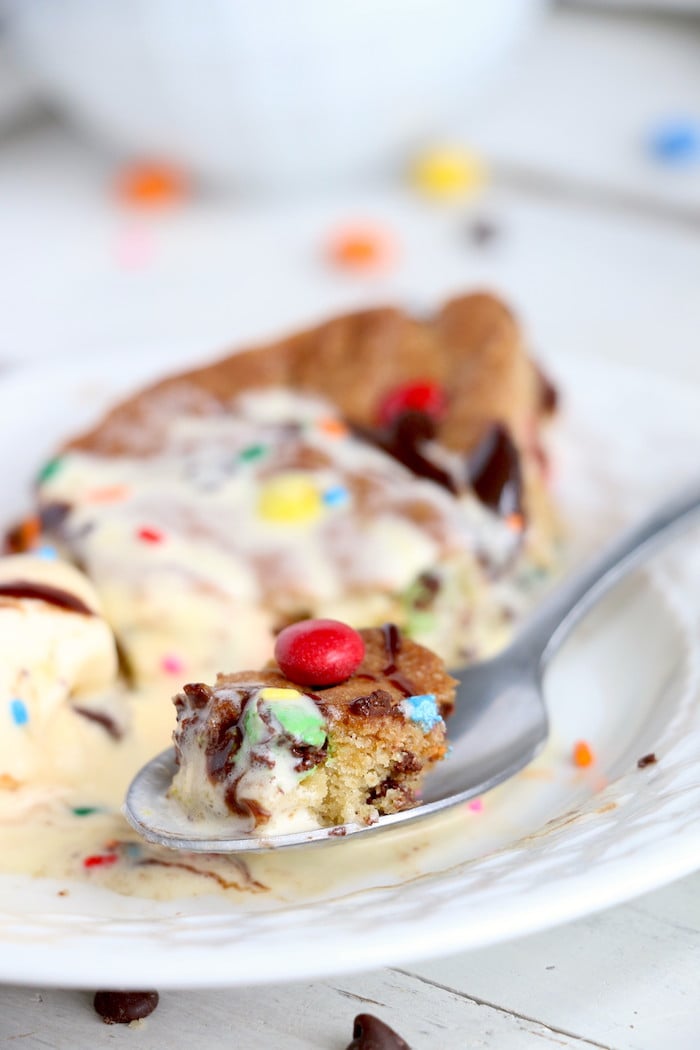 Air Fryer Pizookie - A soft and chewy cookie filled with mini chocolate chips and M&Ms made right in the air fryer in under 10 minutes! Large enough to serve a crowd!