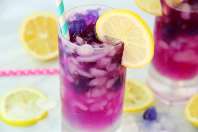 Color Changing Lemonade in glass with lemon garnish