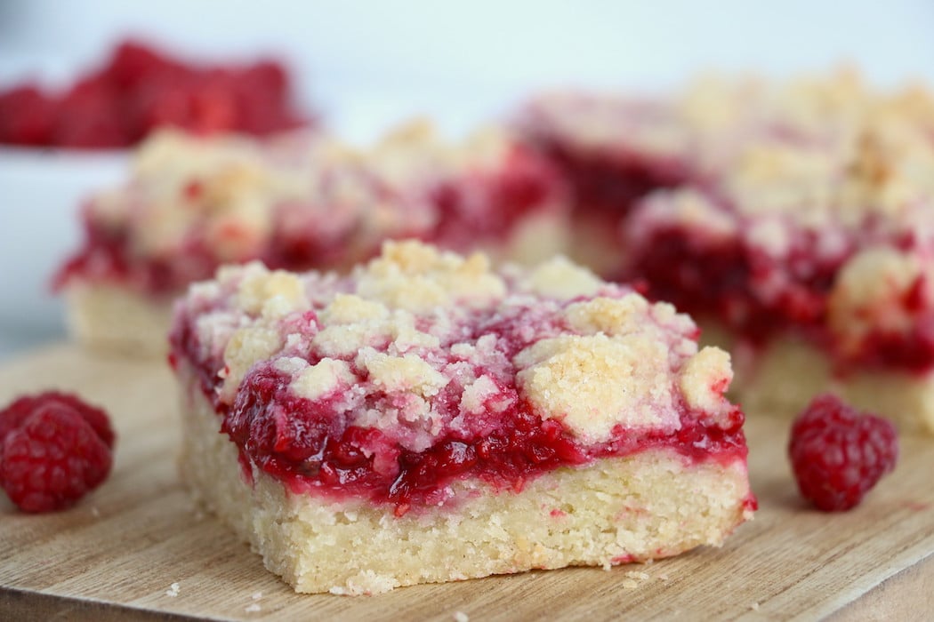 Raspberry Crumble Bars - Fresh, fruity raspberry bars with a buttery crumb topping!