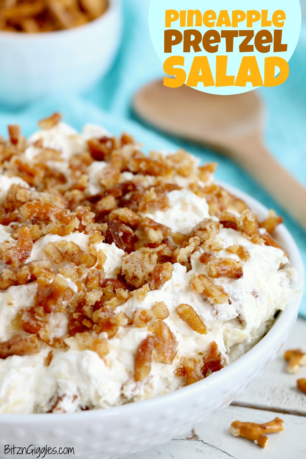 Pineapple Pretzel Salad - This cool, creamy pineapple fluff filled with candied pretzels is the perfect combination of sweet and salty, and can be served as a dessert or sweet side dish!