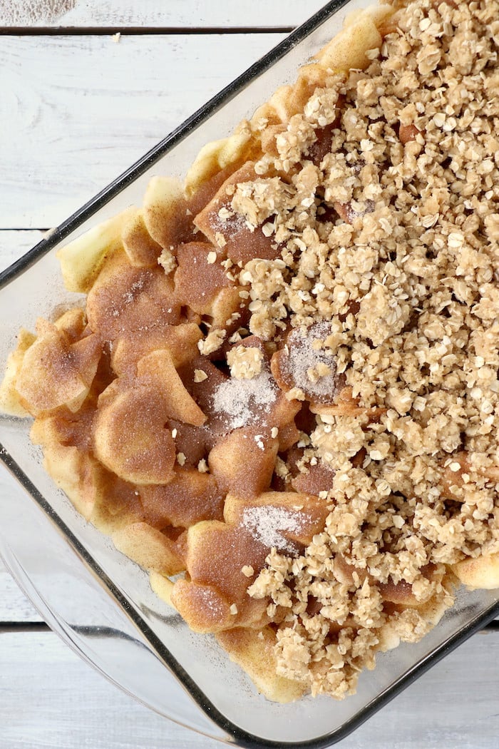 Easy Apple Crisp - A delicious, old-fashioned crisp made with sliced apples and a crunchy brown sugar oat topping. A scoop of vanilla ice cream and salted caramel sauce puts it over the top!