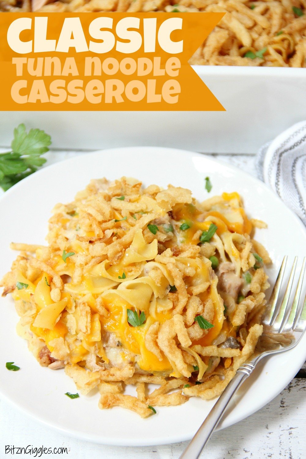 Classic Tuna Noodle Casserole - Ready in under 45 minutes, this classic and comforting casserole features tuna, onions, mushrooms, peas and cheese in a creamy sauce topped with more cheese and crunchy French fried onions! So flavorful, and sure to satisfy the entire family!