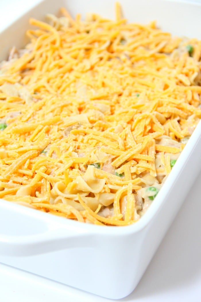 Classic Tuna Noodle Casserole - Ready in under 45 minutes, this classic and comforting casserole features tuna, onions, mushrooms, peas and cheese in a creamy sauce topped with more cheese and crunchy French fried onions! So flavorful, and sure to satisfy the entire family! 