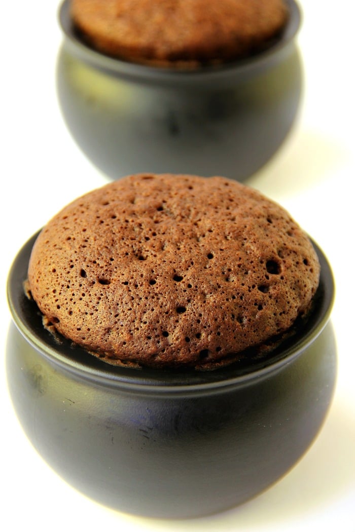 Witch Cauldron Mug Cake - A chocolate mug cake made in a ceramic witch cauldron with halloween-themed frosting and sprinkles! 